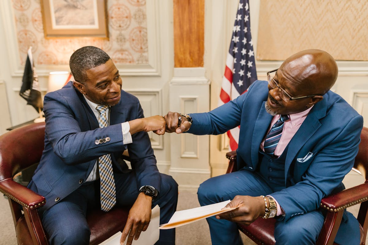 a lawyer and an entrepreneur doing a fist bump